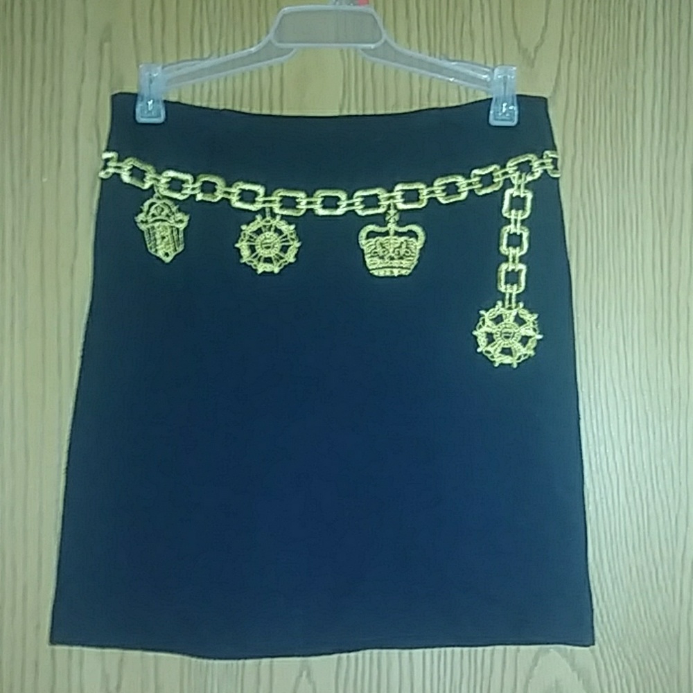 Black embellished mini skirt.
